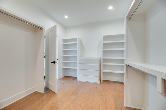 spacious closet with light hardwood / wood-style floors