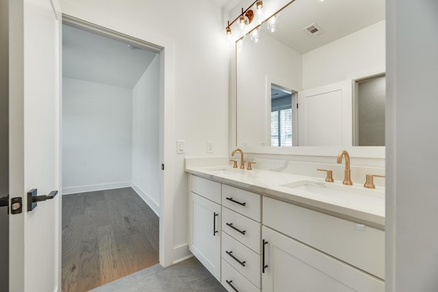 bathroom featuring hardwood / wood-style flooring and vanity