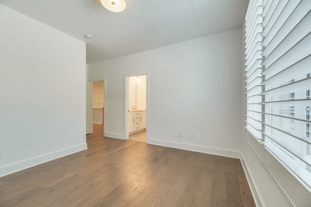 unfurnished room with dark hardwood / wood-style floors