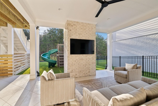 view of patio / terrace with ceiling fan and an outdoor living space