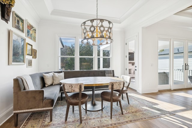 dining space with a wealth of natural light, breakfast area, and a notable chandelier