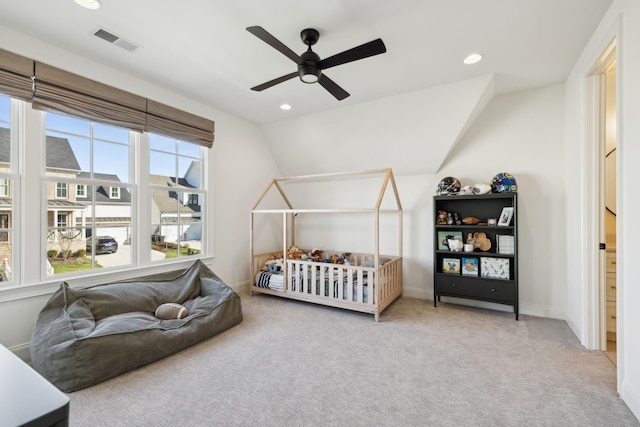 carpeted bedroom featuring vaulted ceiling and ceiling fan