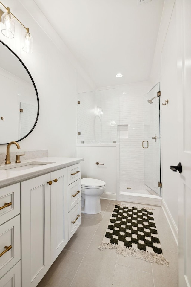 bathroom featuring an enclosed shower, vanity, tile patterned flooring, and toilet