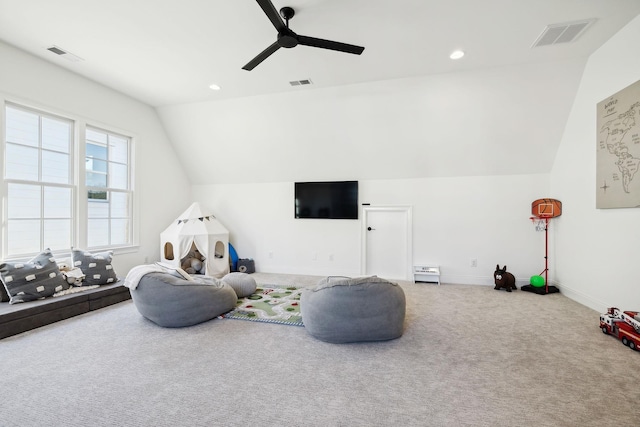 playroom with vaulted ceiling, ceiling fan, and carpet flooring