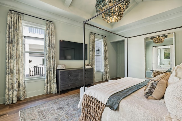 bedroom featuring vaulted ceiling with beams, wood-type flooring, and ornamental molding