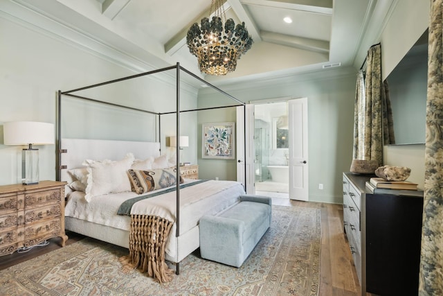 bedroom with hardwood / wood-style floors, ensuite bath, ornamental molding, a chandelier, and lofted ceiling with beams