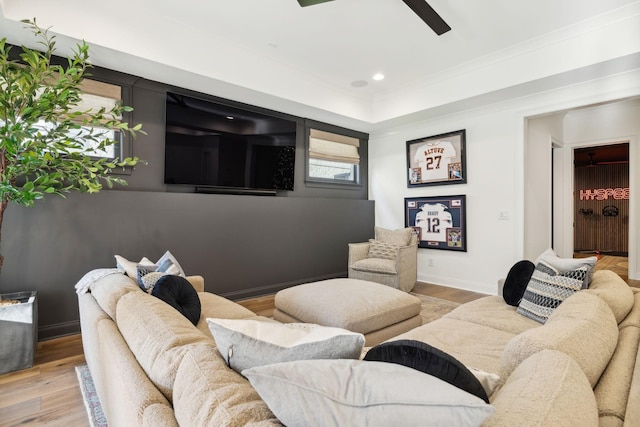 living room with light hardwood / wood-style floors and ceiling fan