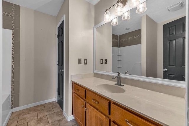 bathroom with tile patterned floors and vanity