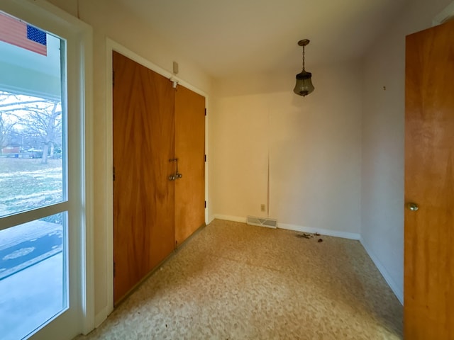 empty room featuring plenty of natural light