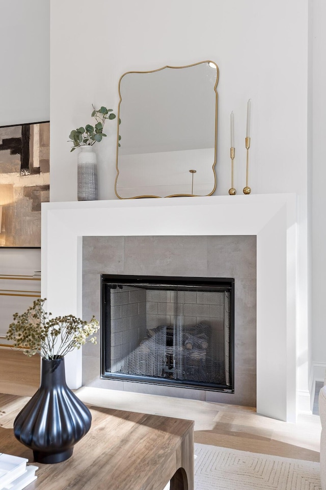 interior details with a tiled fireplace