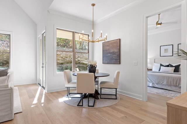 dining space featuring light hardwood / wood-style flooring, plenty of natural light, and crown molding