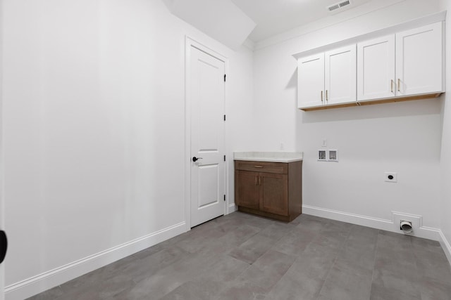 laundry area featuring electric dryer hookup, cabinets, ornamental molding, and hookup for a washing machine