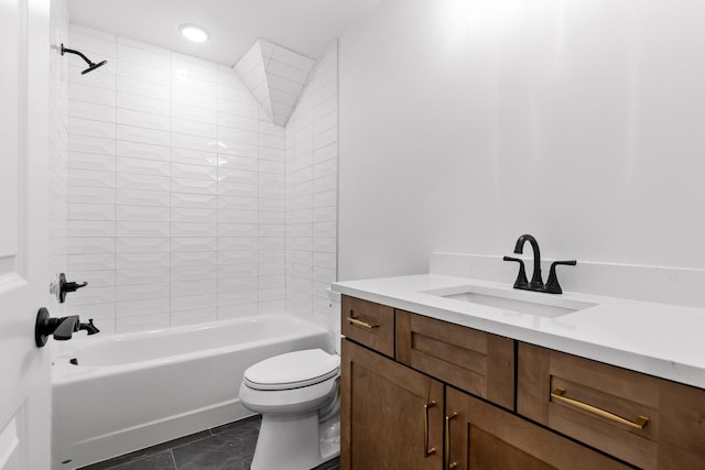 full bathroom featuring tile patterned floors, vanity, tiled shower / bath combo, and toilet