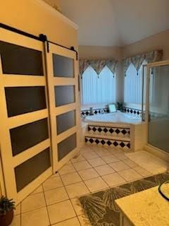 bathroom featuring tile patterned flooring, ornamental molding, and plus walk in shower