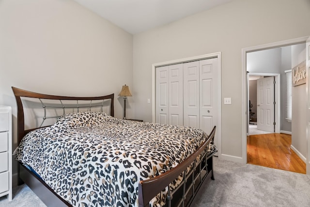 carpeted bedroom with a closet