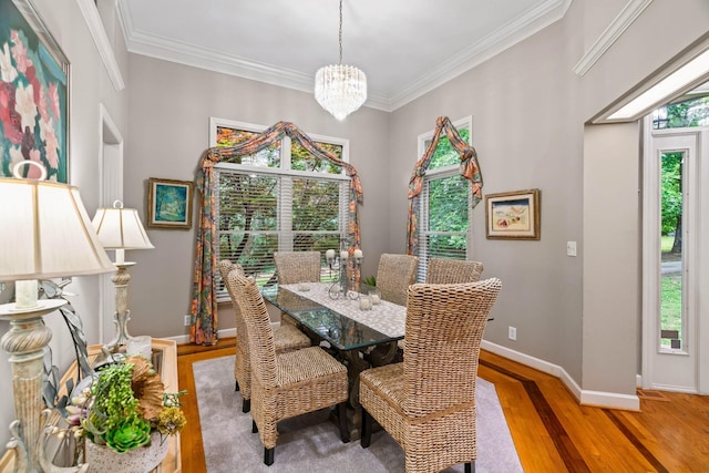 dining room featuring light hardwood / wood-style floors, a wealth of natural light, and a chandelier