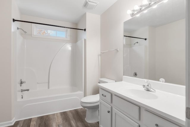 full bathroom featuring shower / bath combination, vanity, toilet, and wood-type flooring