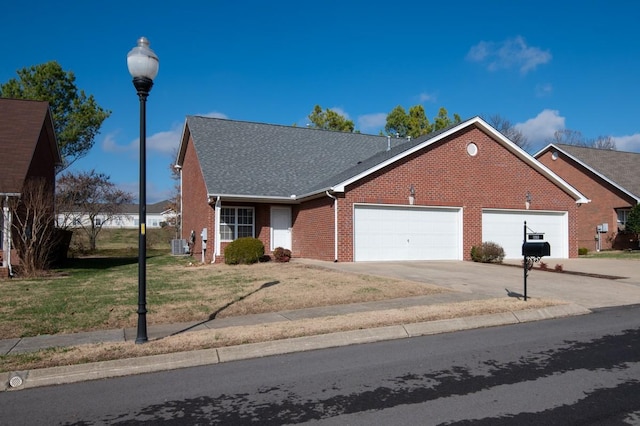 view of front of home with a garage and a front lawn