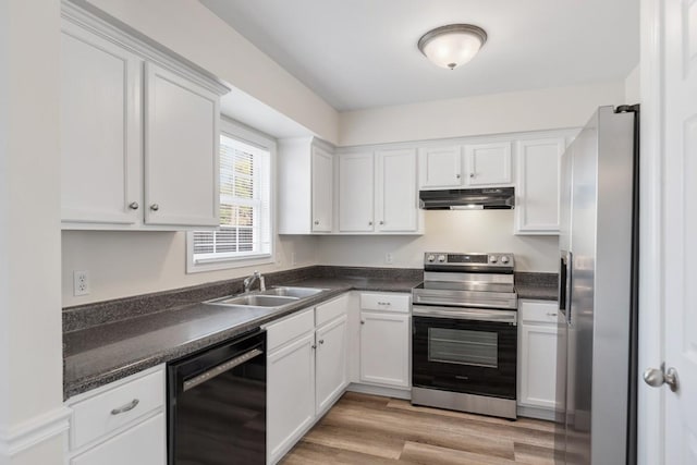 kitchen featuring white cabinets, appliances with stainless steel finishes, light hardwood / wood-style flooring, and sink