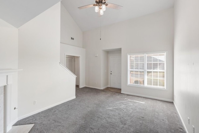 unfurnished living room featuring carpet, ceiling fan, and high vaulted ceiling