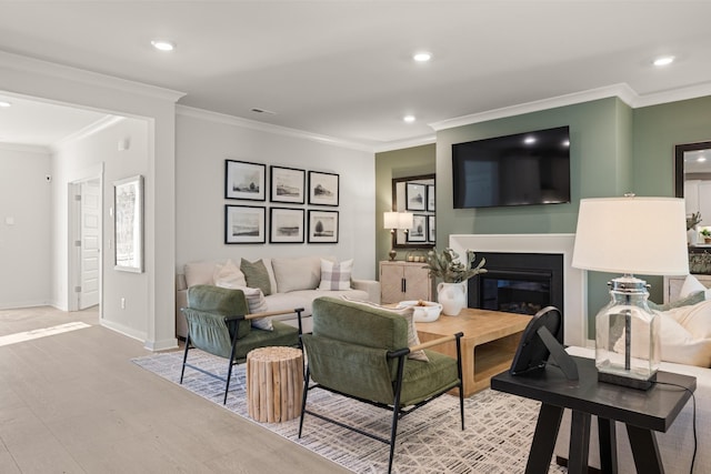 living room featuring crown molding and hardwood / wood-style floors