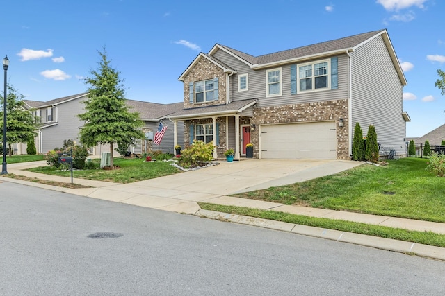 view of front of home with a front lawn and a garage