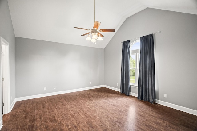 empty room with ceiling fan, dark wood-type flooring, and vaulted ceiling