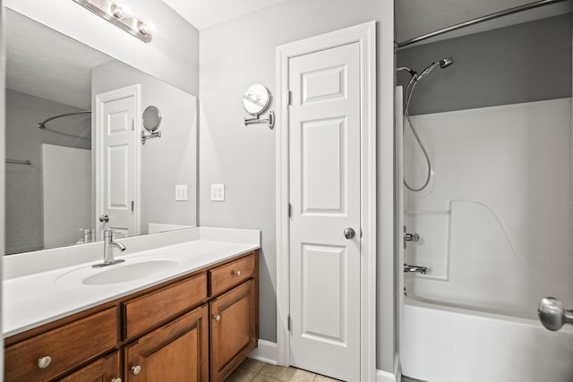 bathroom featuring bathing tub / shower combination, tile patterned flooring, and vanity