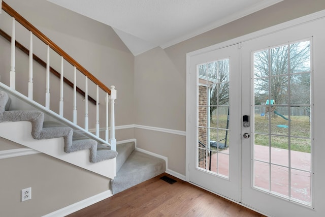 doorway with french doors and hardwood / wood-style floors