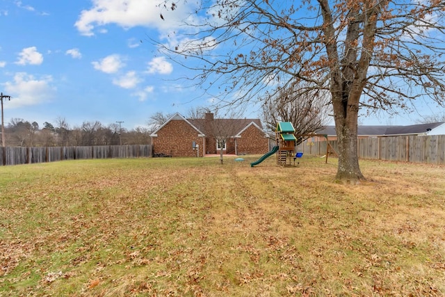 view of yard featuring a playground