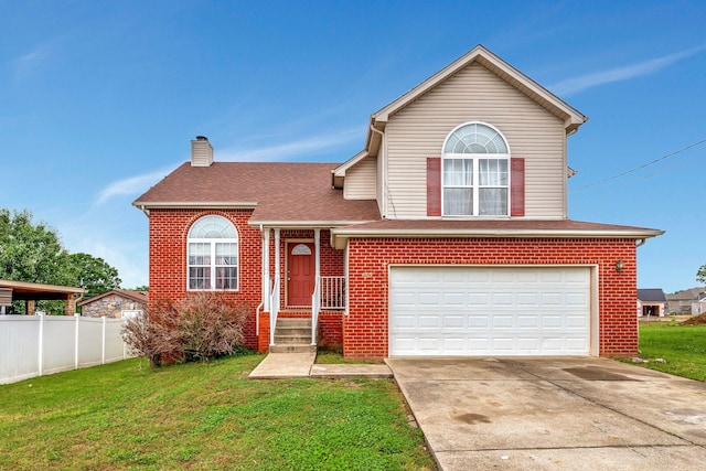 view of front of home with a garage and a front yard