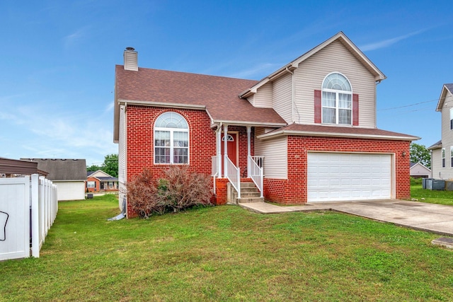 view of front of property with a garage and a front lawn