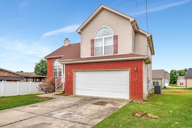 view of front of property featuring central AC unit, a garage, and a front lawn