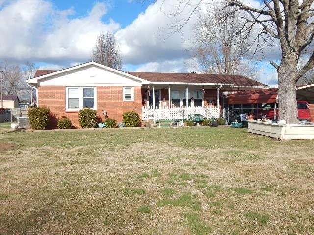 single story home featuring a front yard and a porch