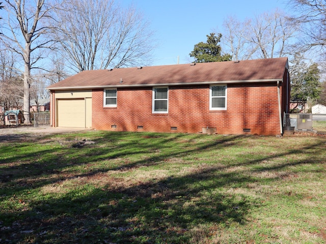 rear view of property with a yard