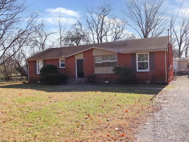 ranch-style house with a front lawn