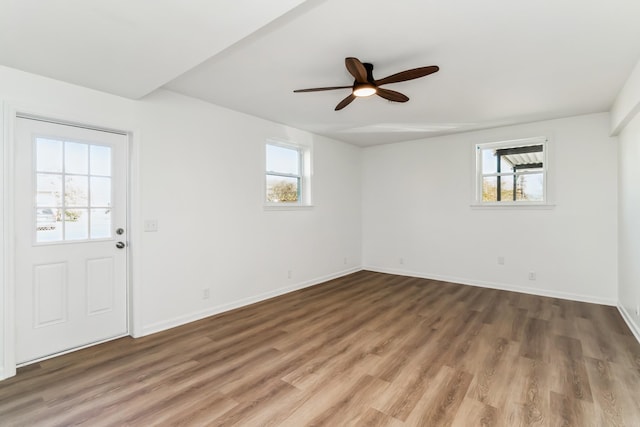 entrance foyer with ceiling fan and dark hardwood / wood-style floors