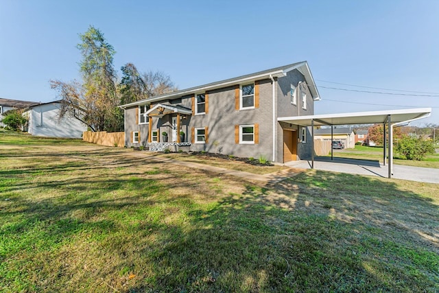 view of front facade featuring a front lawn and a carport