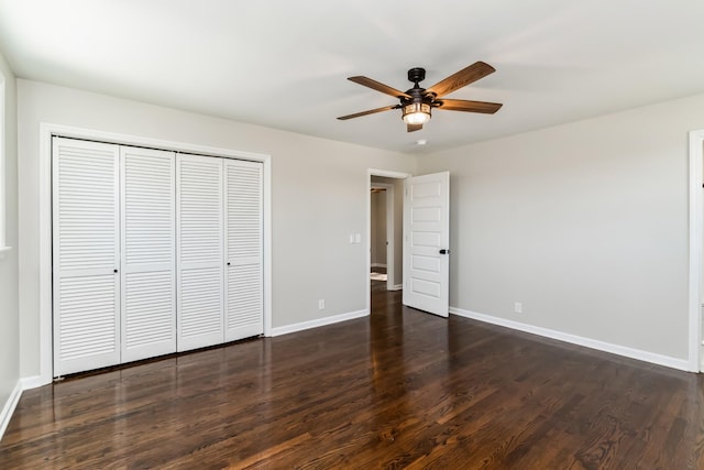 unfurnished bedroom featuring a closet, ceiling fan, and dark hardwood / wood-style flooring