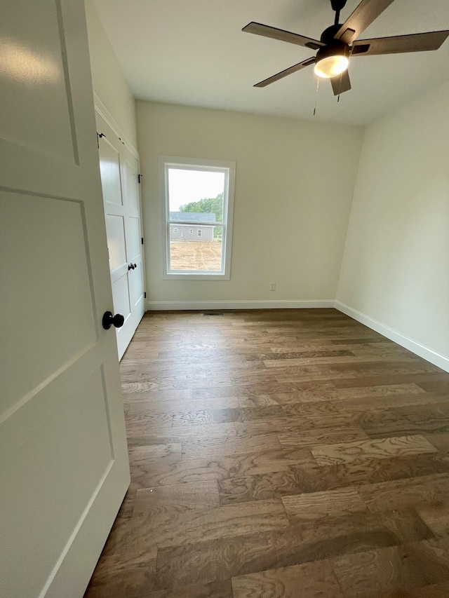 58 Union Hill Rd, Loretto, TN 38469 - unfurnished room featuring ceiling fan and dark wood-type flooring