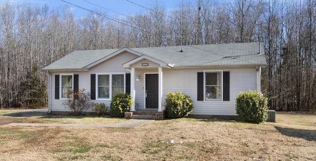 single story home featuring a front yard and central AC