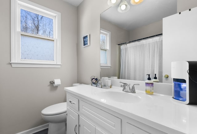 bathroom with toilet and vanity