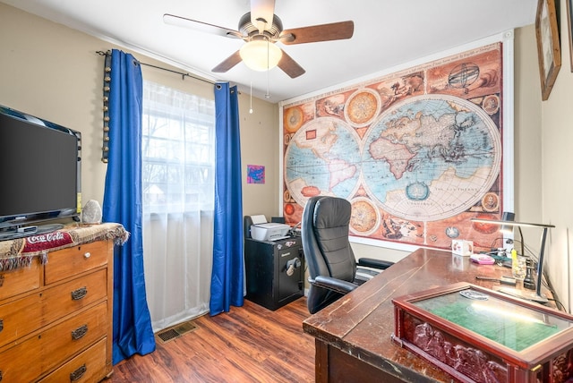 home office featuring ceiling fan and dark hardwood / wood-style flooring