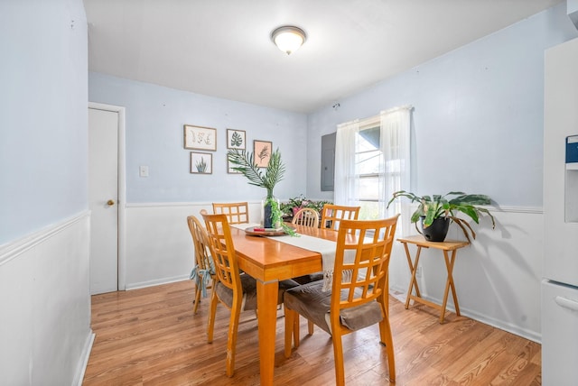 dining space featuring light wood-type flooring