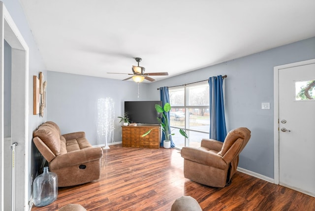 living room with ceiling fan and hardwood / wood-style floors