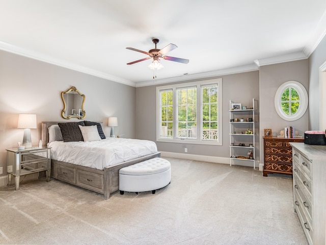 carpeted bedroom with ceiling fan and crown molding