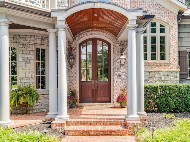 view of exterior entry featuring french doors