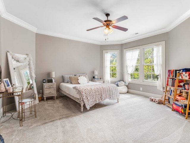 bedroom featuring carpet, ceiling fan, and crown molding