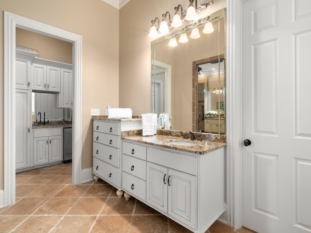 bathroom featuring vanity and ornamental molding