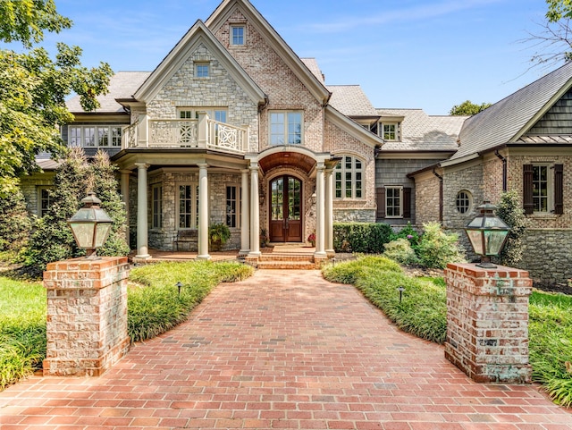 view of front of property with a balcony